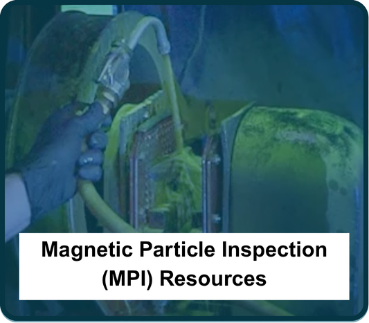 Action shot of an employee doing a magnetic particle inspection (MPI) to test the structural integrity of a metal part.
