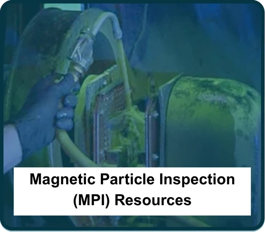 Action shot of an employee doing a magnetic particle inspection (MPI) to test the structural integrity of a metal part.
